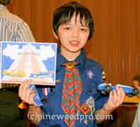 cub scout pinewood derby winner with car