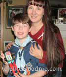 Cub scout with Mom and his pinewood derby car