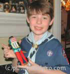Proud Cub Scout with his Derby Car